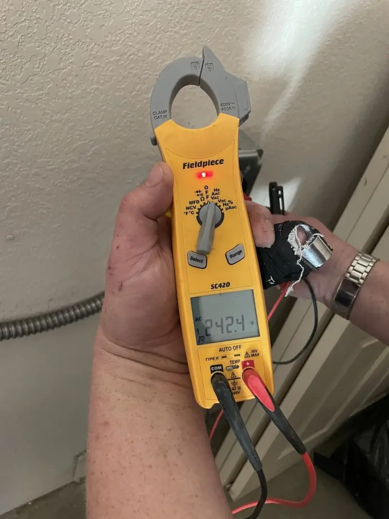 Voltage testing with clamp meter during Generator Installation in Hideaway